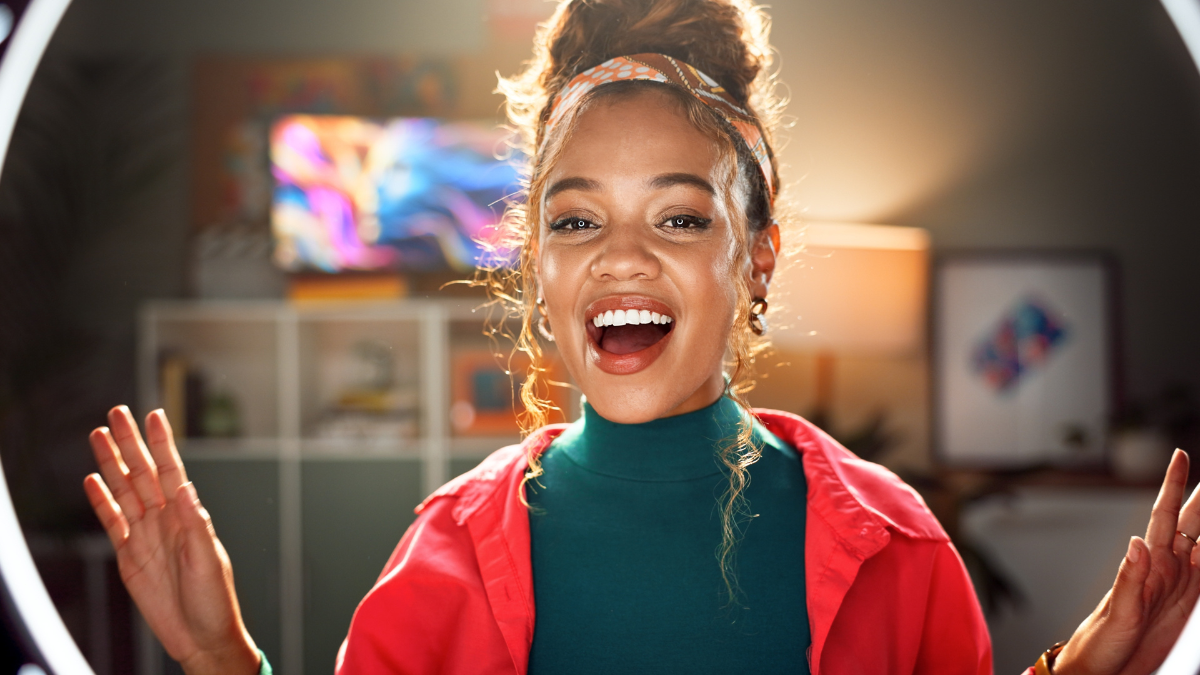 Happy woman, portrait and influencer with ring light for content creation, vlogging or online tutorial at home. Young, female person or vlogger in POV with makeup for tips, advice or video recording. Most Viral Finance Advice.