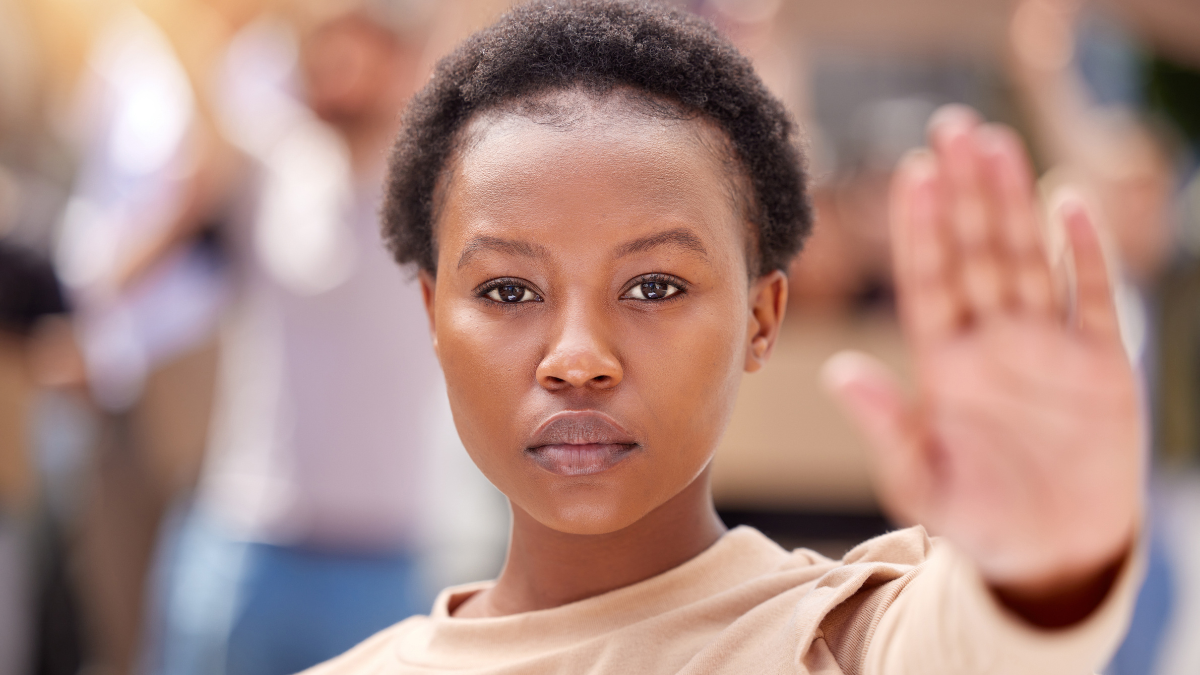 Black woman, portrait and hand for stop at protest for public justice, change or government. Female person, face and feminist equality for gender pay gap or community strike, march or human rights.